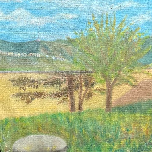 a painting of khialchè by day: green hills with a mast and white houses, a long pale wall, dark pomegranate trees in a gold field, a young yellow-green tree, grass and a round grey stone